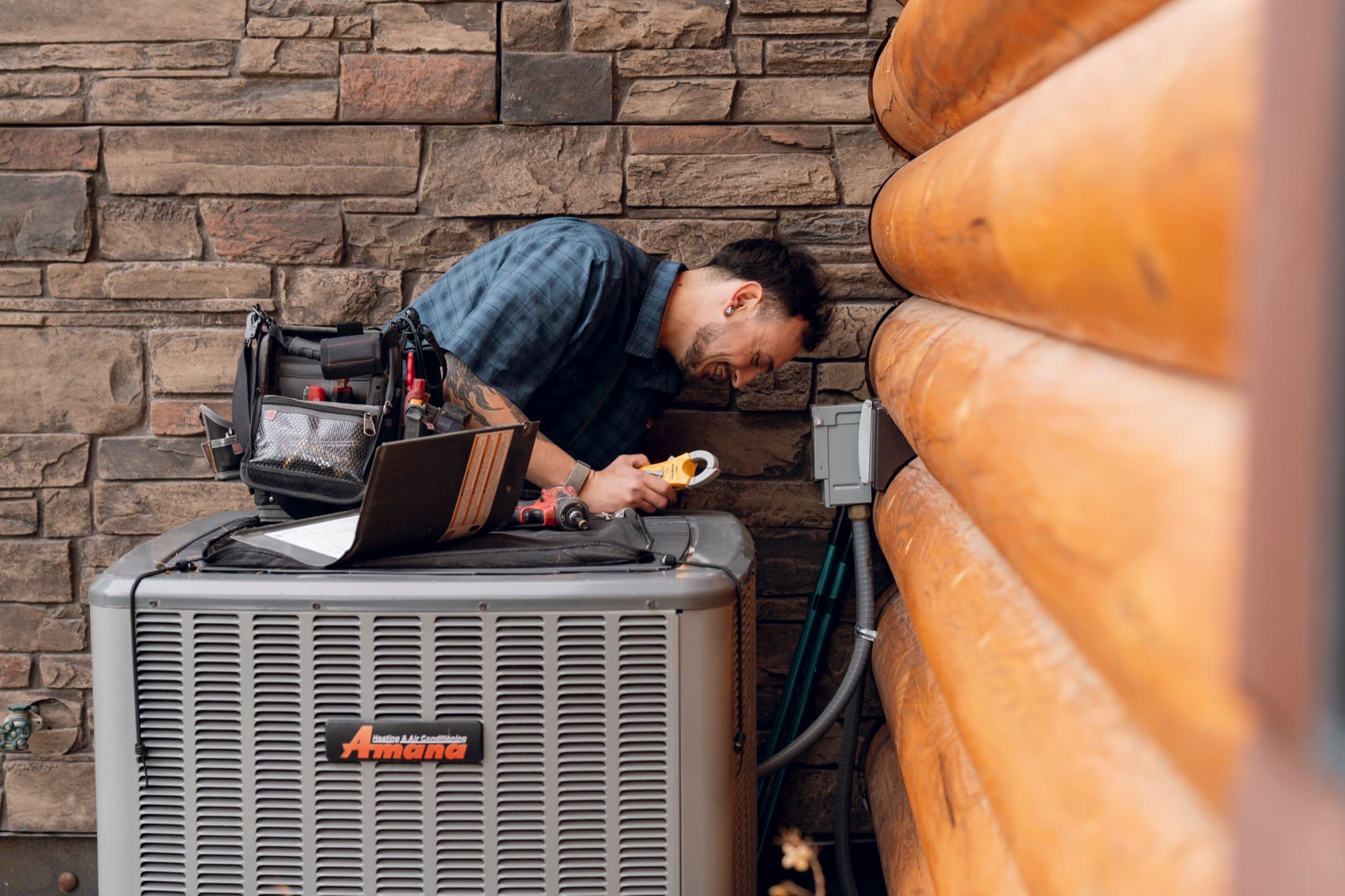 Eagle Heating and Air technician performing preventive AC maintenance
