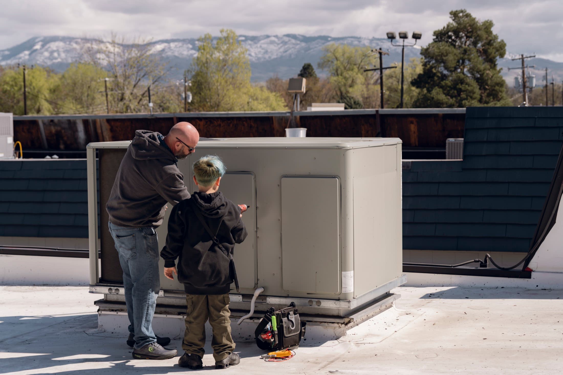 Eagle Heating and Air technicians servicing rooftop commercial HVAC equipment