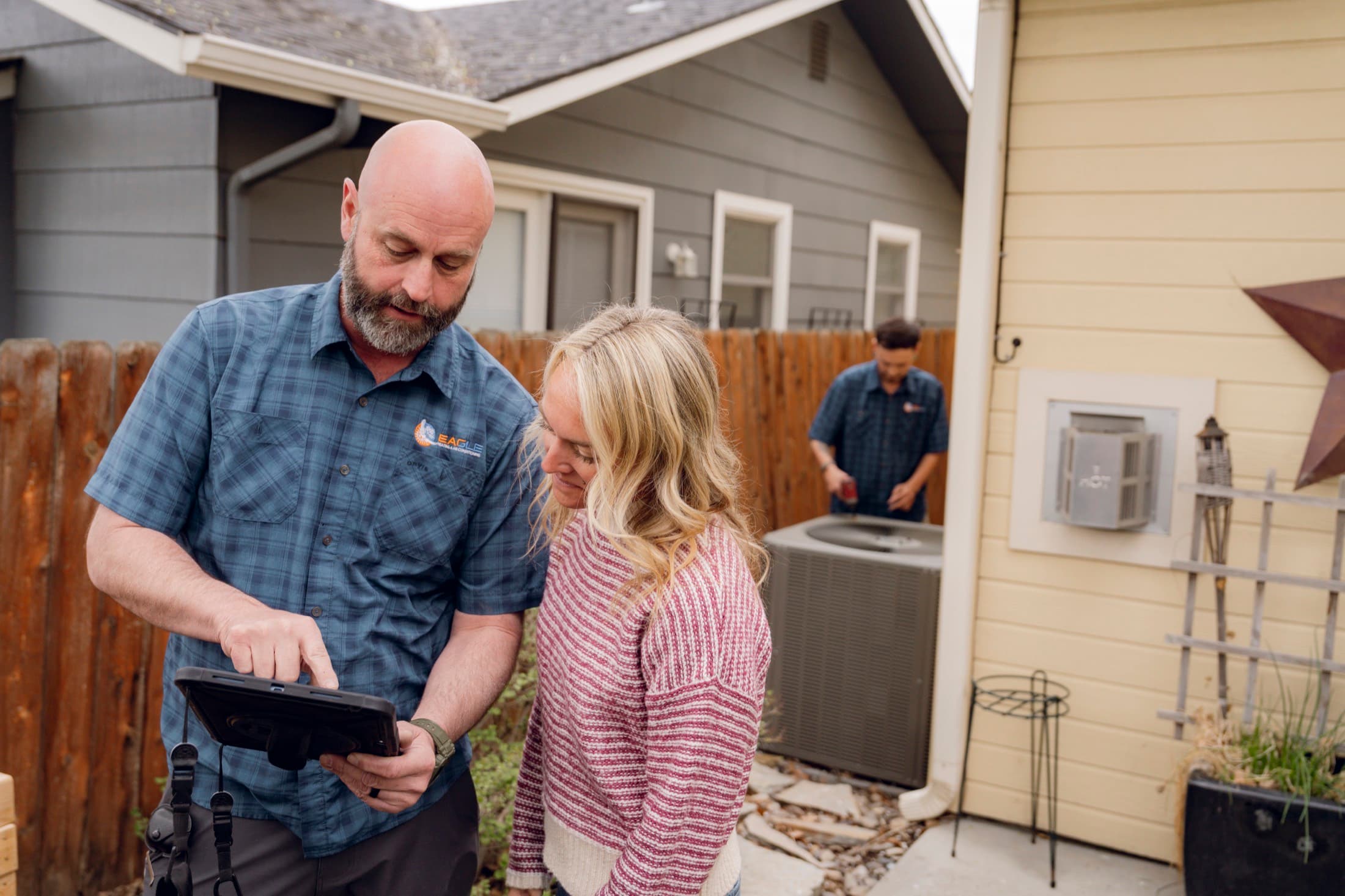 Eagle Heating and Air owner reviewing system details with a Treasure Valley homeowner