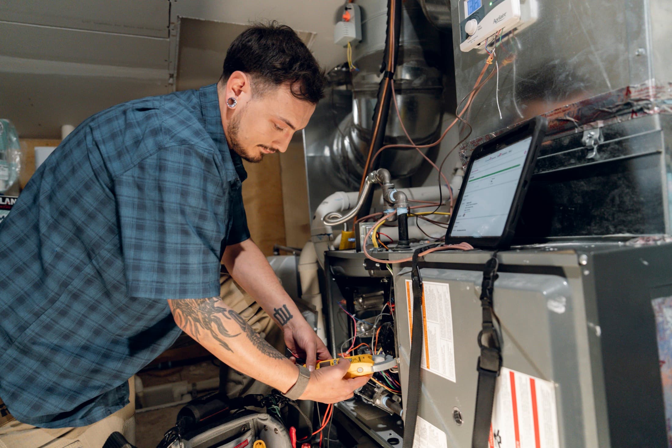 Eagle Heating and Air technician diagnosing residential HVAC equipment