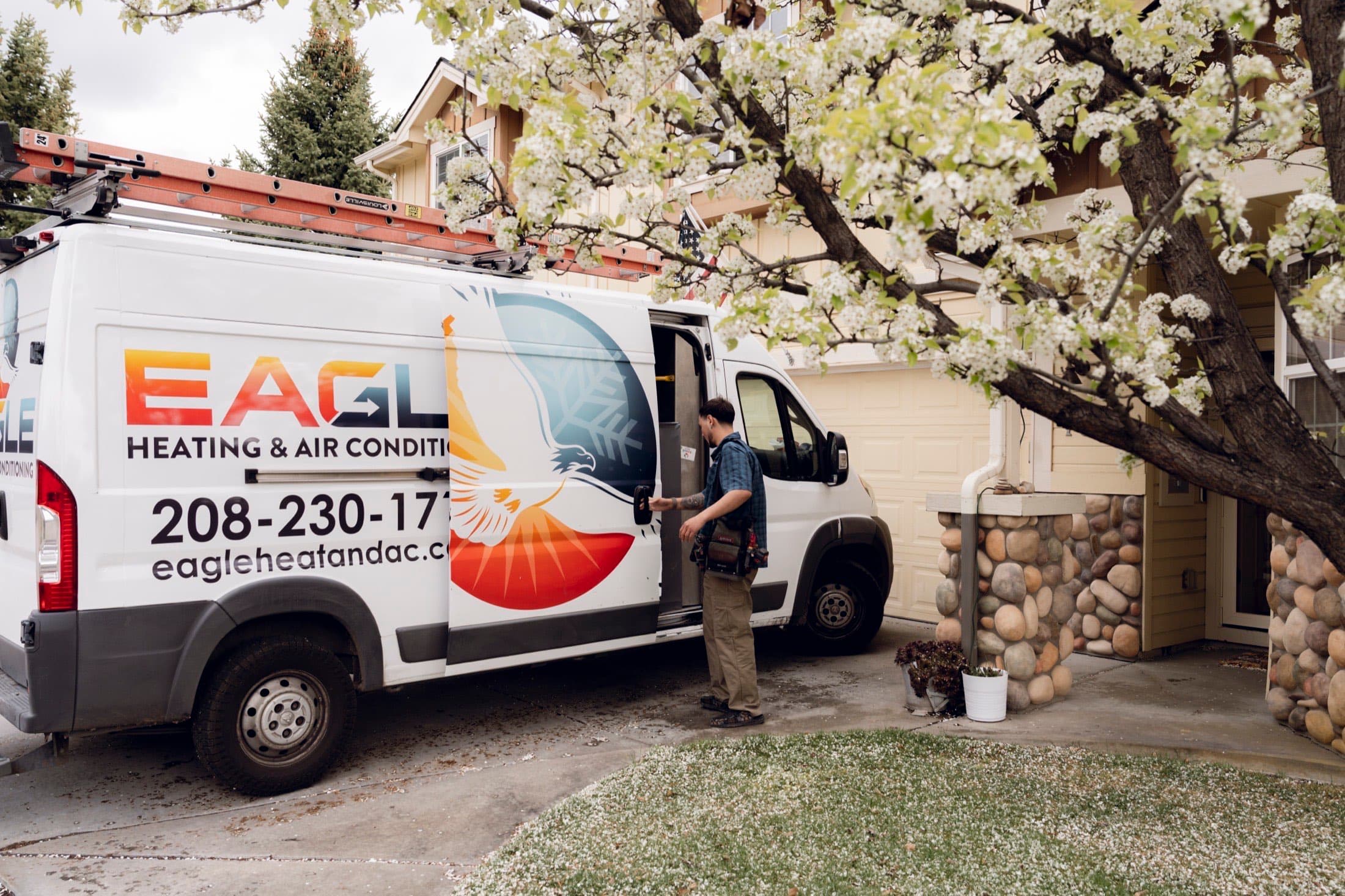 Eagle Heating and Air technician arriving at a Treasure Valley home with the branded service van